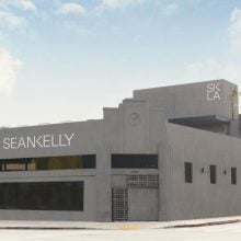 A low-slung but large building with a gray exterior