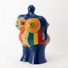 A colorful, stylized vase of a blue woman in a technicolor swimsuit. Featured in the Evelyn D. Farland Collection sale at Doyle New York.