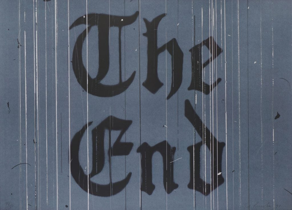 A black on grey image with the words THE END in gothic font