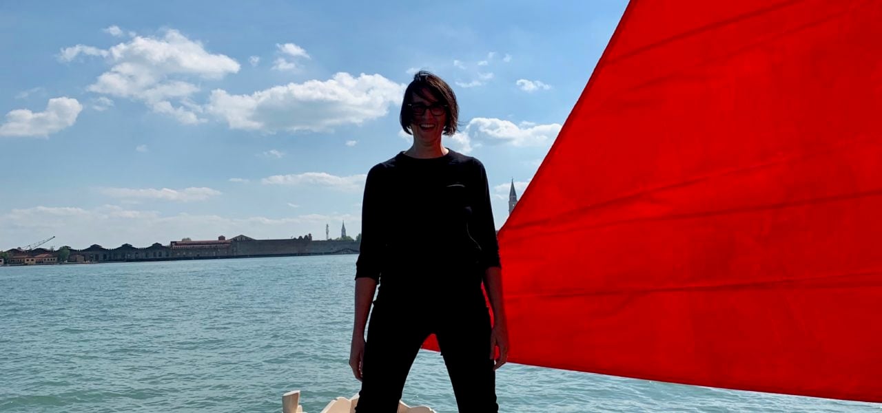 Melissa McGill with one of the boats for her project Red Regatta. Photo by Sarah Cascone.