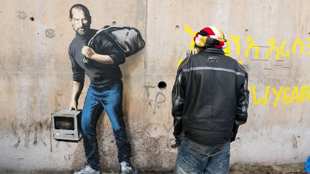 Banksy work in Calais 'Jungle' shows Steve Jobs as migrant Steve-jobs-banksy