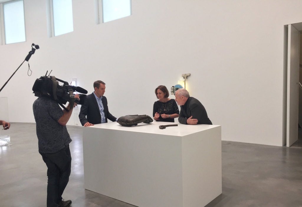 Jeff Koons and Damien Hirst filming with the BBC. Photo: Newport Street Gallery via Facebook